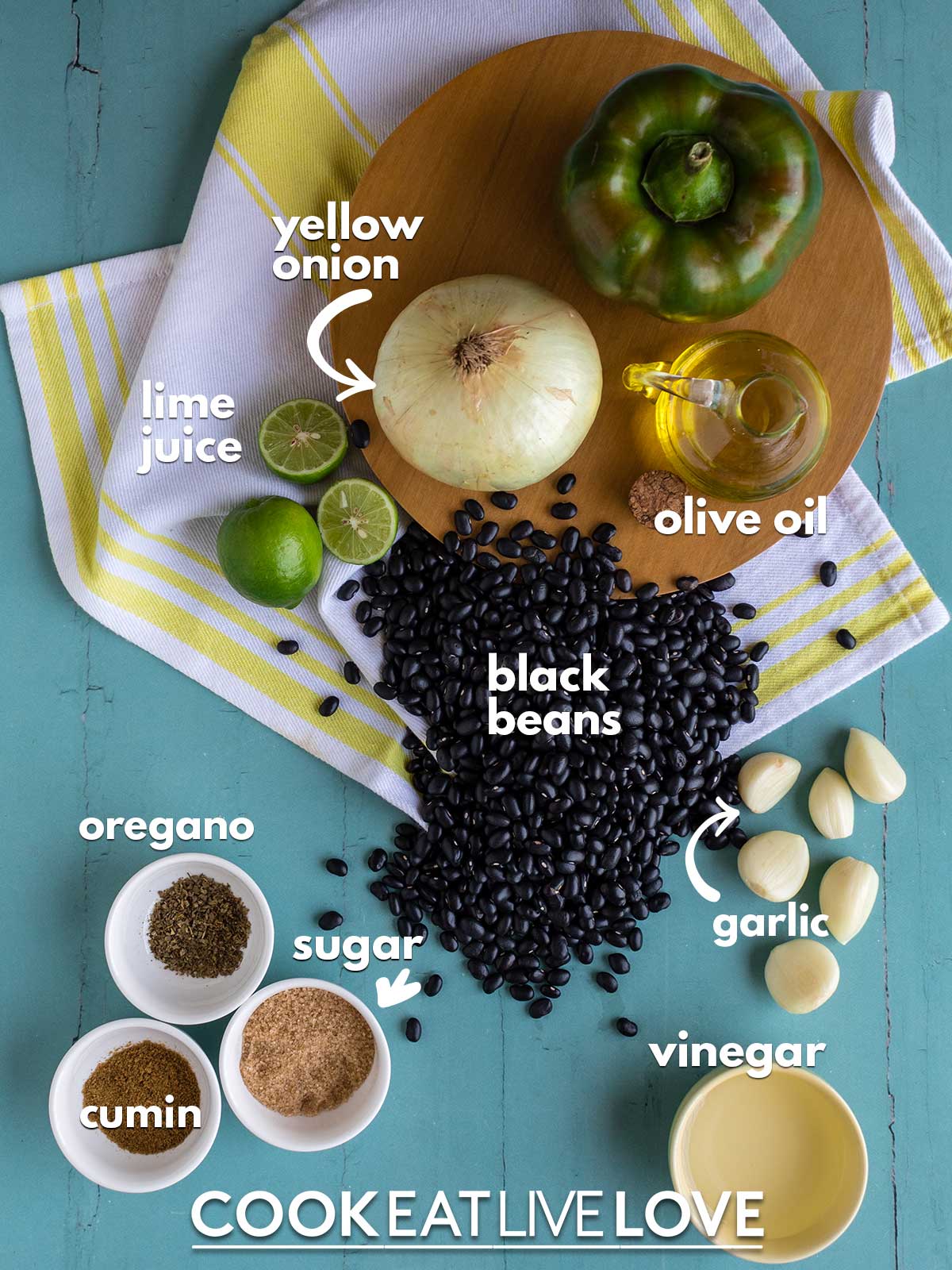 Ingredients to make cuban black beans instant pot on the table with text labels