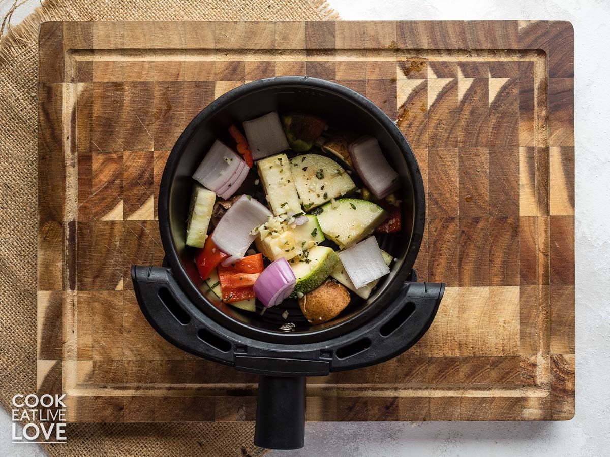 Air fryer roasted vegetables in the basket ready to cook.
