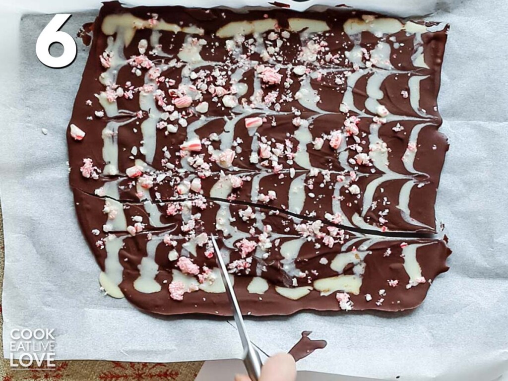 Breaking up the dark chocolate peppermint bark to eat.