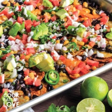 Plate of nachos with salsa on a table