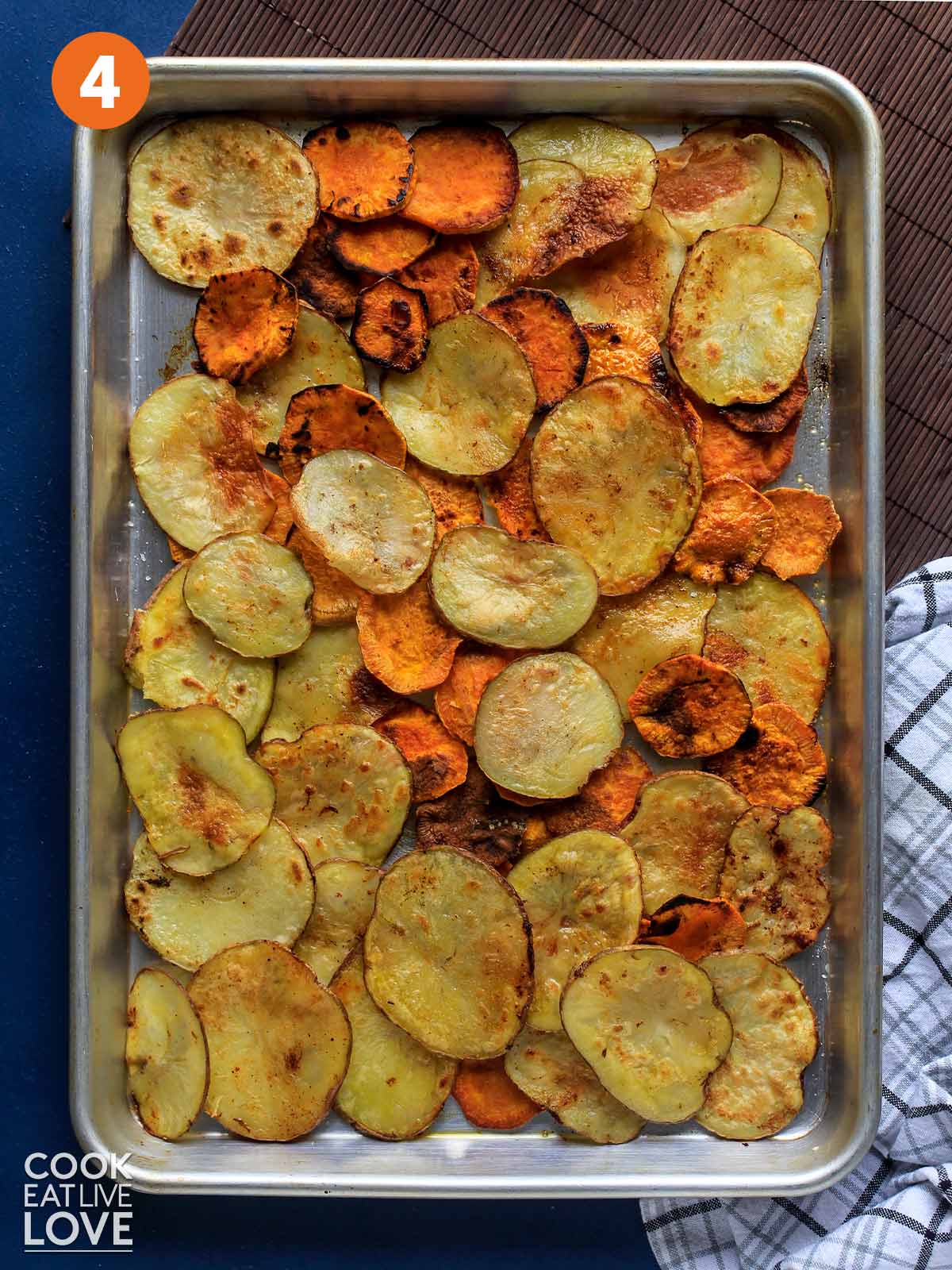 Cooked potatoes on a baking sheet.
