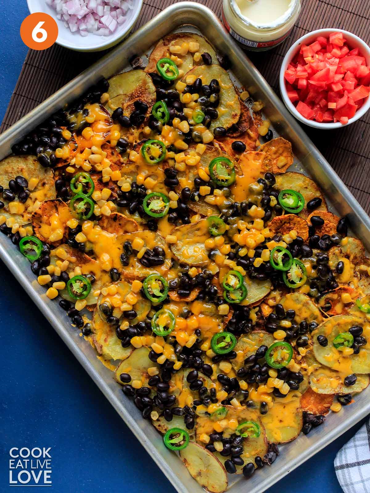 The rest of toppings are added to cooked veggie loaded nachos.