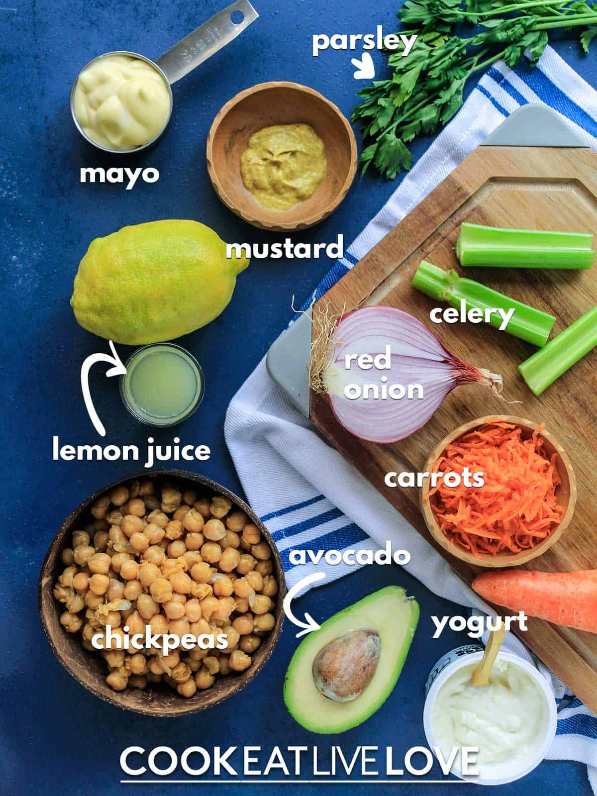 Ingredients to make creamy chickpea salad on the table with text labels
