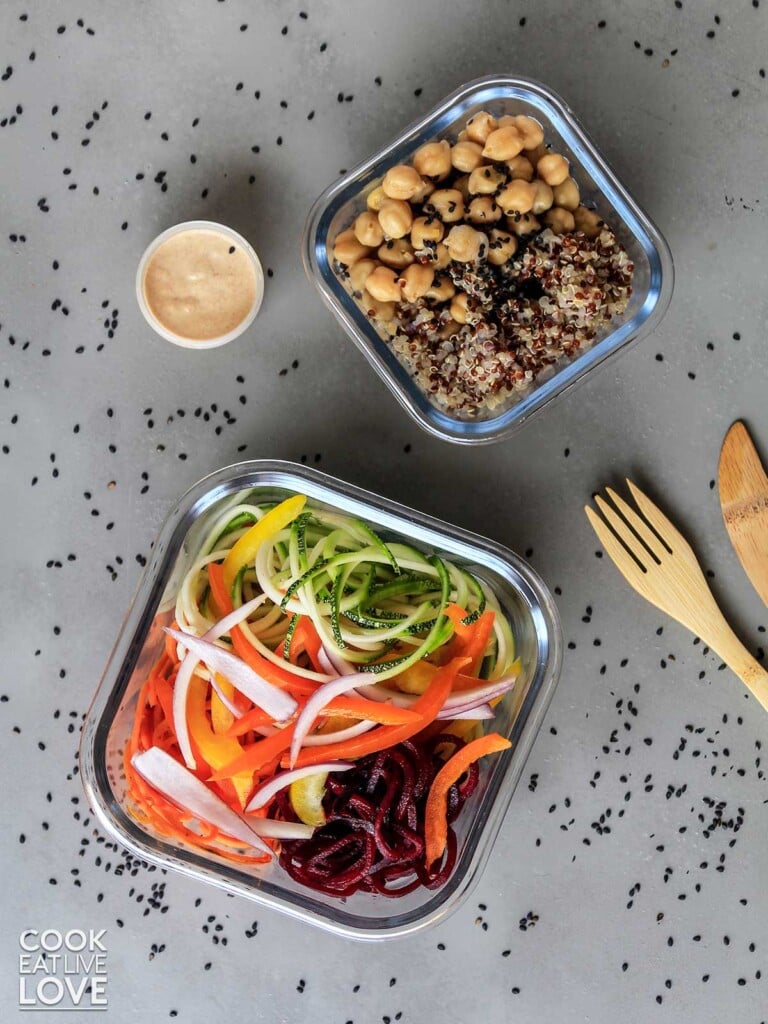 Plant-based meal prep packed up in glass containers to carry to work.