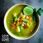 Green soup with vegetables and lime squeeze