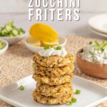 Pin for pinterest graphic with an image of zucchini fritters and text on top.