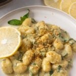 Pinterest graphic with image of pesto gnocchi and text on top.
