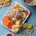 Vegan ceviche on a plate with sweet potatoes and corn