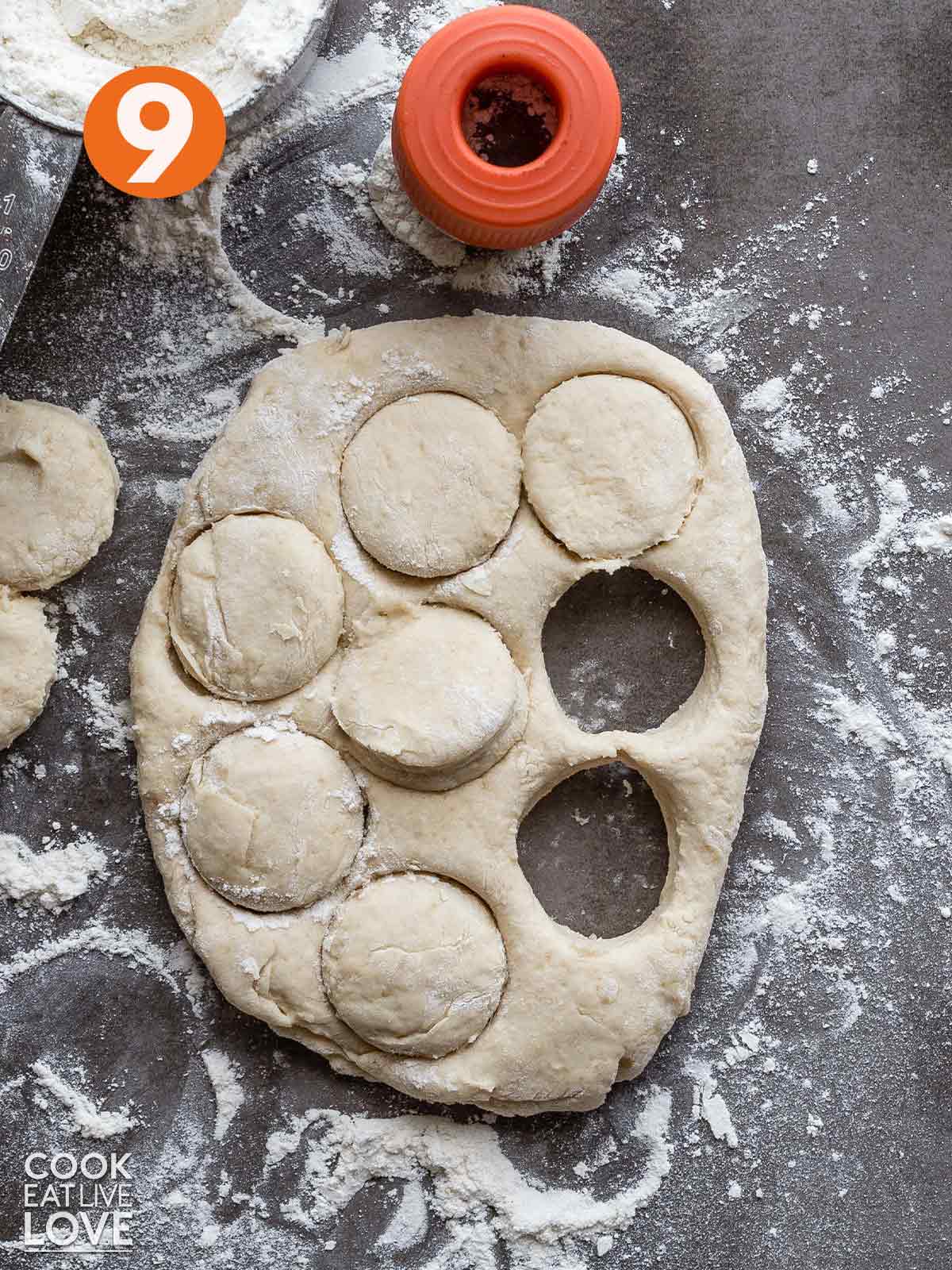 Dough rolled out on the work surface and cut with a biscuit cutter.