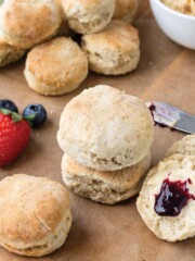 Homemade biscuits on the table in stack and cut open with jam.