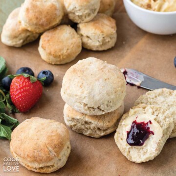 Homemade biscuits on the table in stack and cut open with jam.