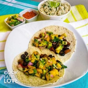Black bean mango tacos ready to eat and served with coconut brown rice.
