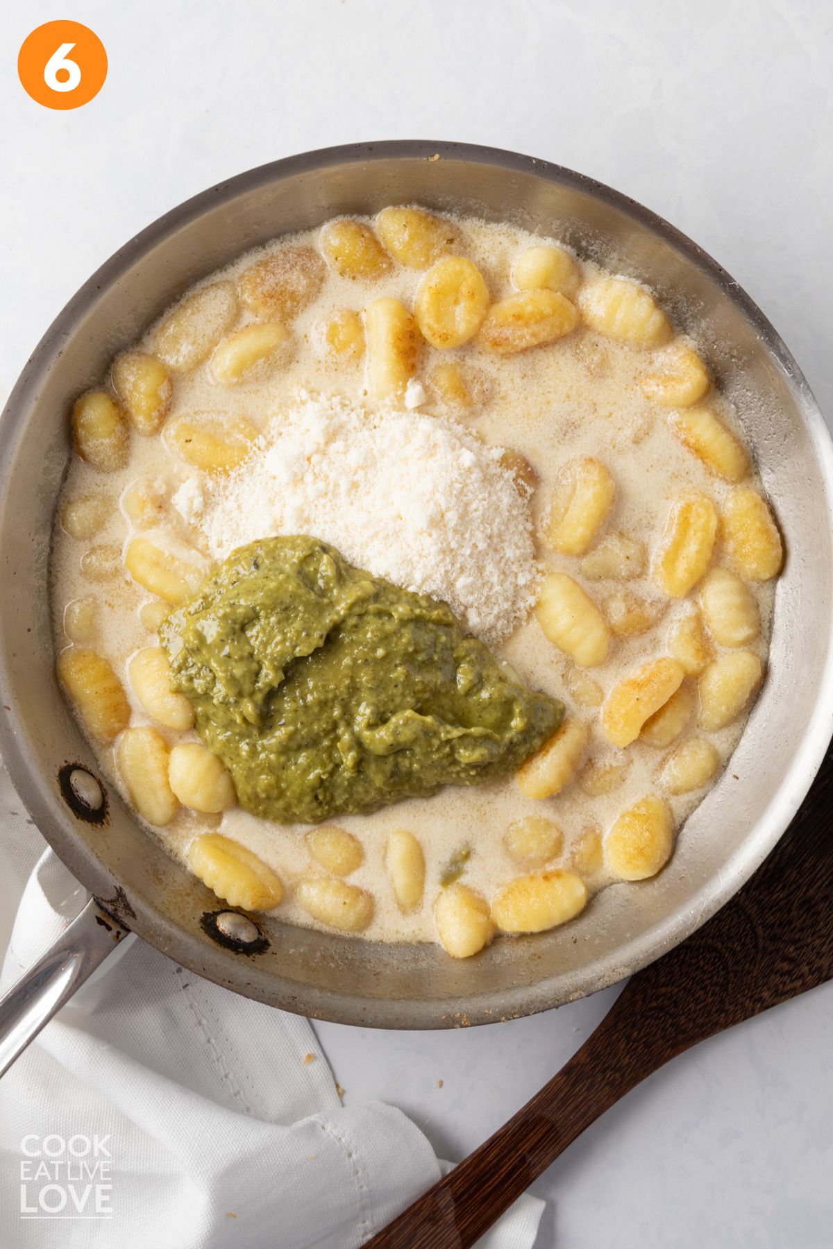 Pesto and Parmesan added to the creamy gnocchi.