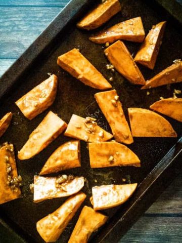 Basalmic miso sweet potatoes on a pan fresh from the oven.