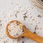 Pinterest graphic with image of rosemary salt and text on top.