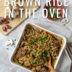 Pin for pinterest with image of brown rice casserole on the table with text on top.
