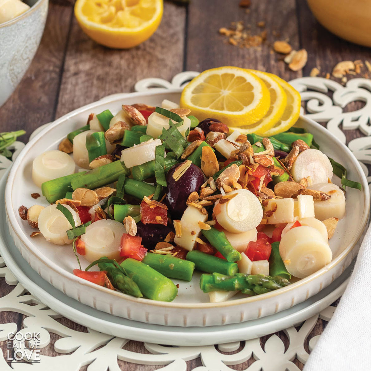 Hearts of palm salad on a white plate on the table.