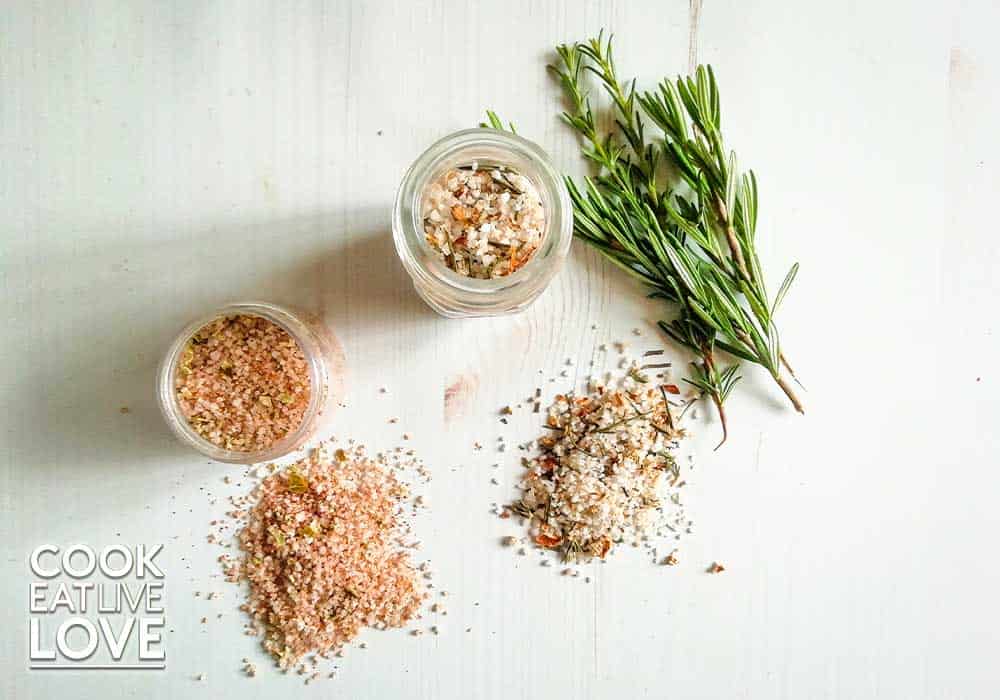 Homemade herb salt blends are in jars to give away and shown in small pile on background as well.