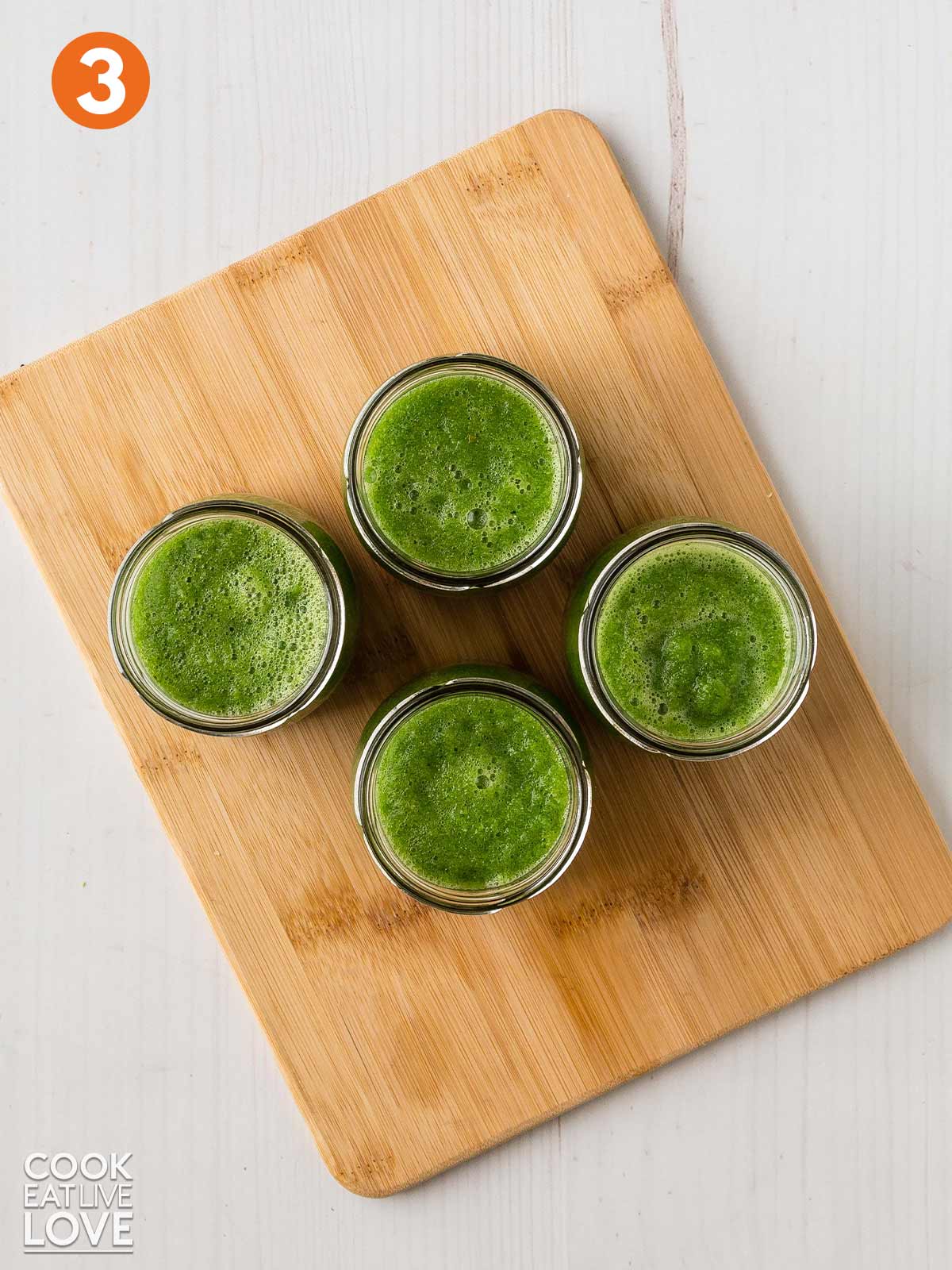 Green smoothie base in jars.