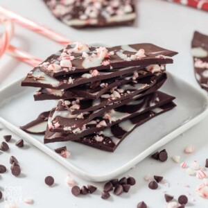 Stack of vegan peppermint bark on a small plate.