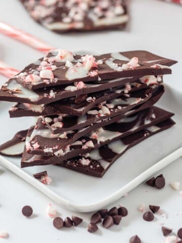 Stack of vegan peppermint bark on a small plate.