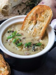 Easy potato leek soup topped with frizzled leeks.