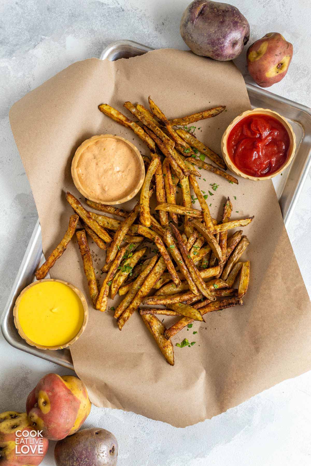 Oven baked fries with sauces.