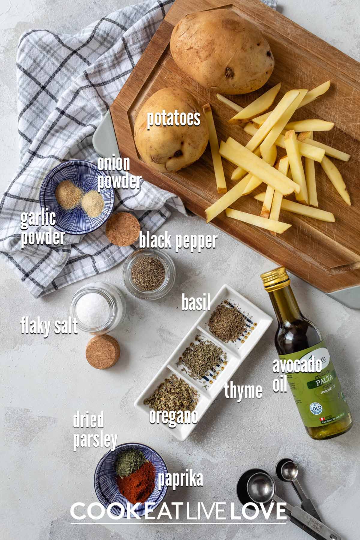 Ingredients to make oven baked french fries on the table.