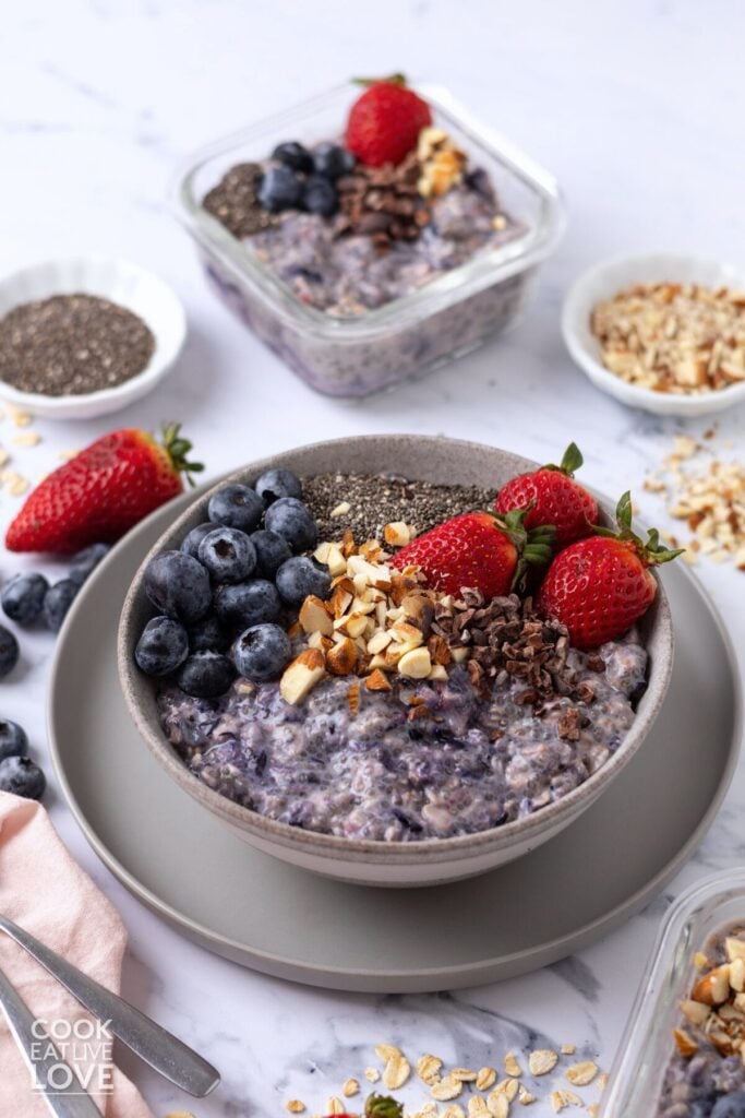 A bowl of chia seed overnight oats topped with berries, almonds, and chia seeds.