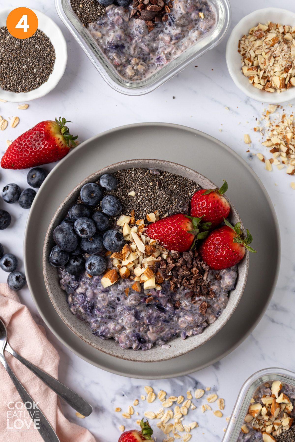 Overnight oat bowl with chia seeds topped with assorted toppings.