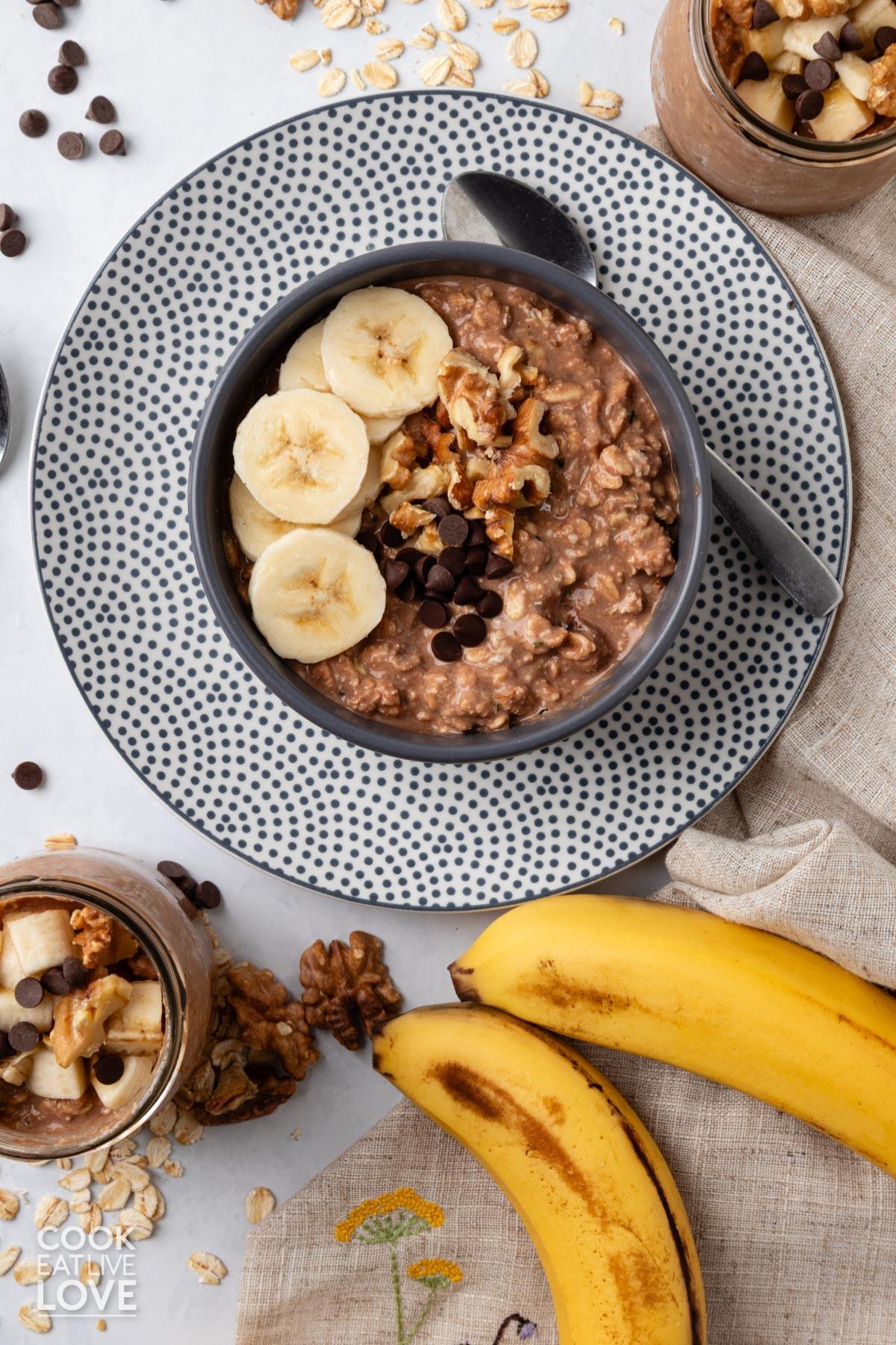 Chunky monkey overnight oats in a bowl topped with toppings.
