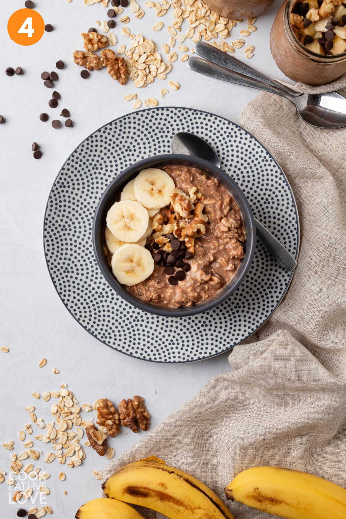 Chunky monkey banana overnight oats in a bowl topped with bananas and more toppings.