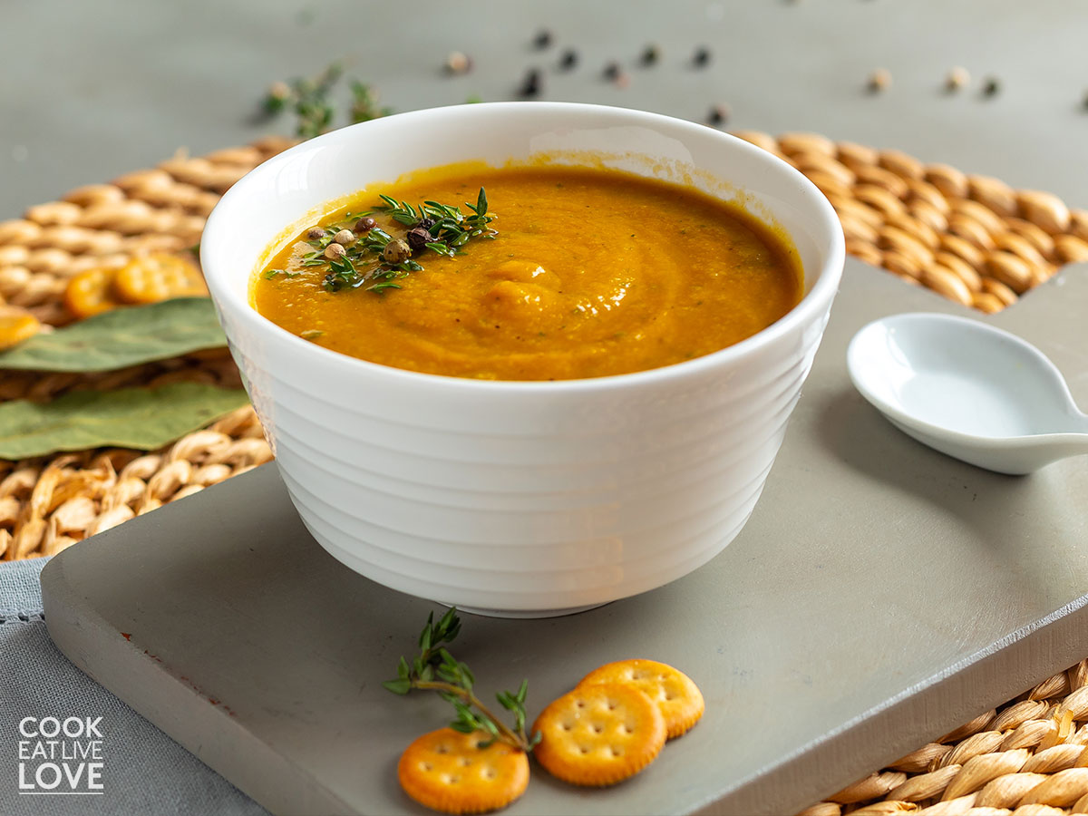 Bowl of carrot cauliflower soup on a table