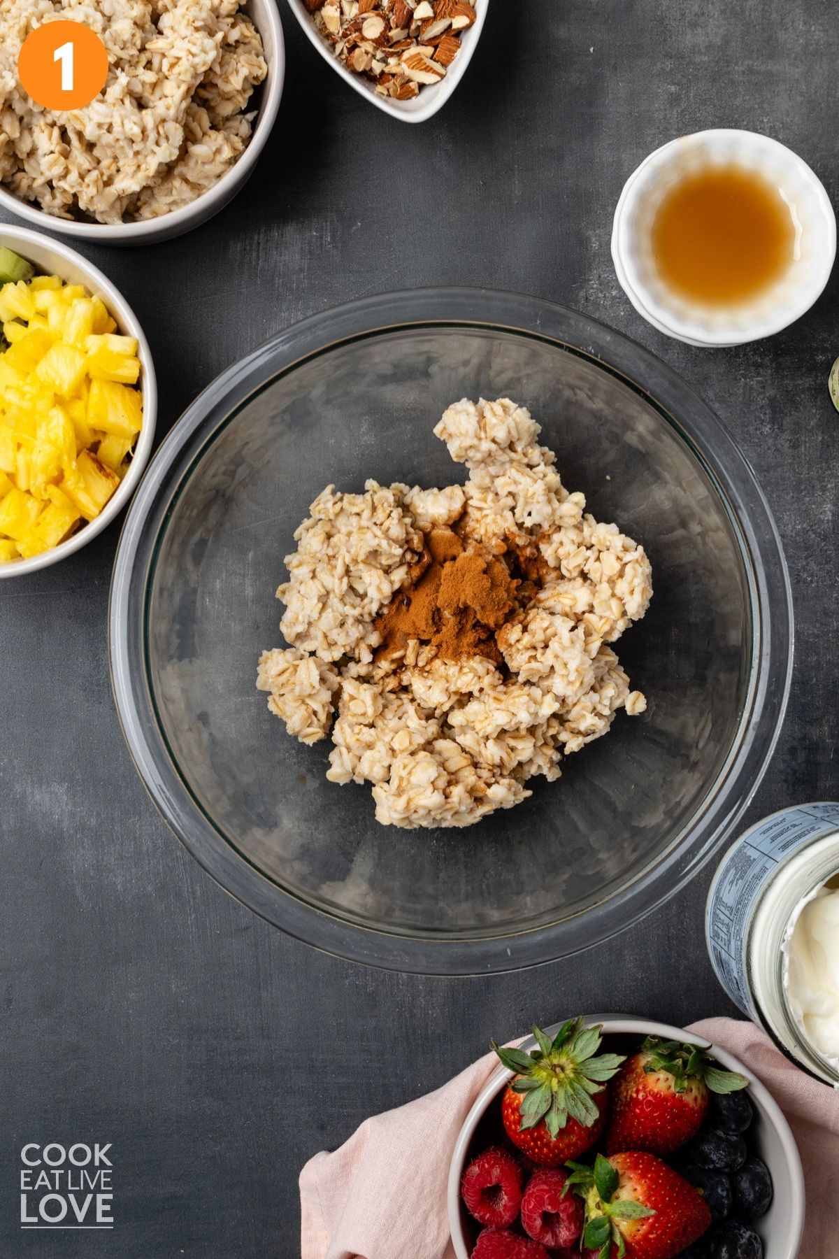 Oatmeal in a bowl with cinnamon and maple syrup added.