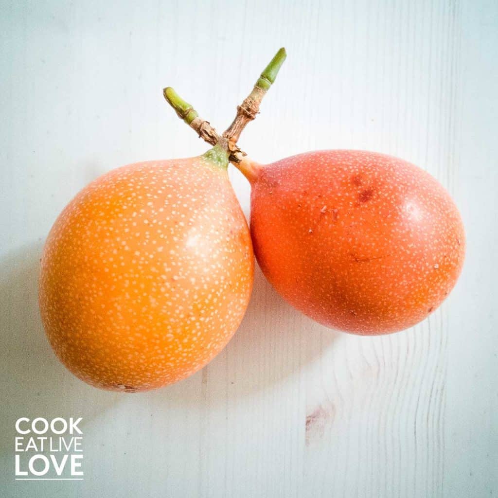 Food in Lima inlcudes grenadilla a light orange fruit with a smooth shell with white speckles.