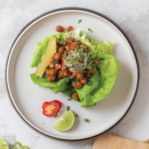 Vegetarian lettuce wraps with buffalo chickpeas are shown prepared and ready to eat.