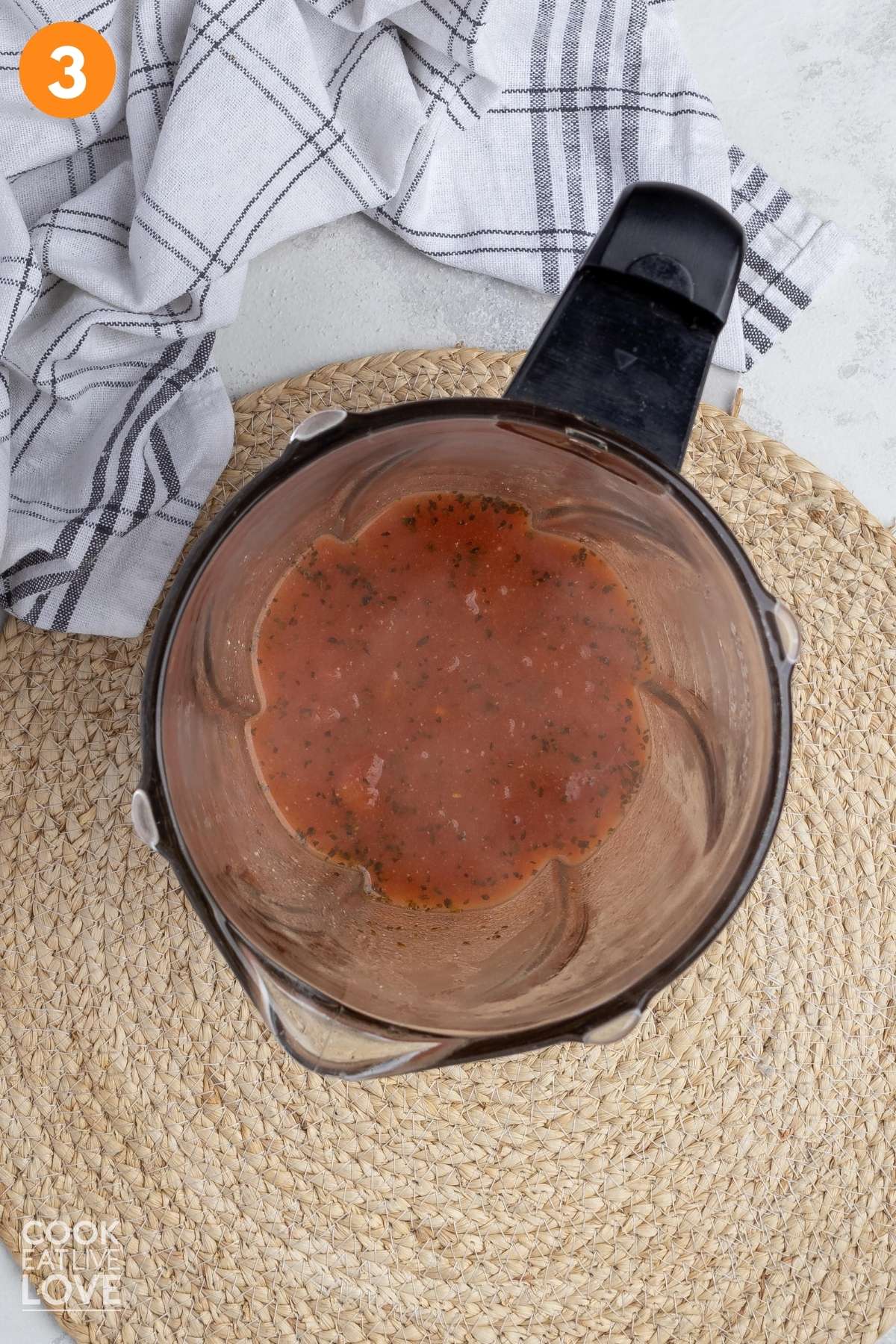 Cooked soup added to a blender to blend.