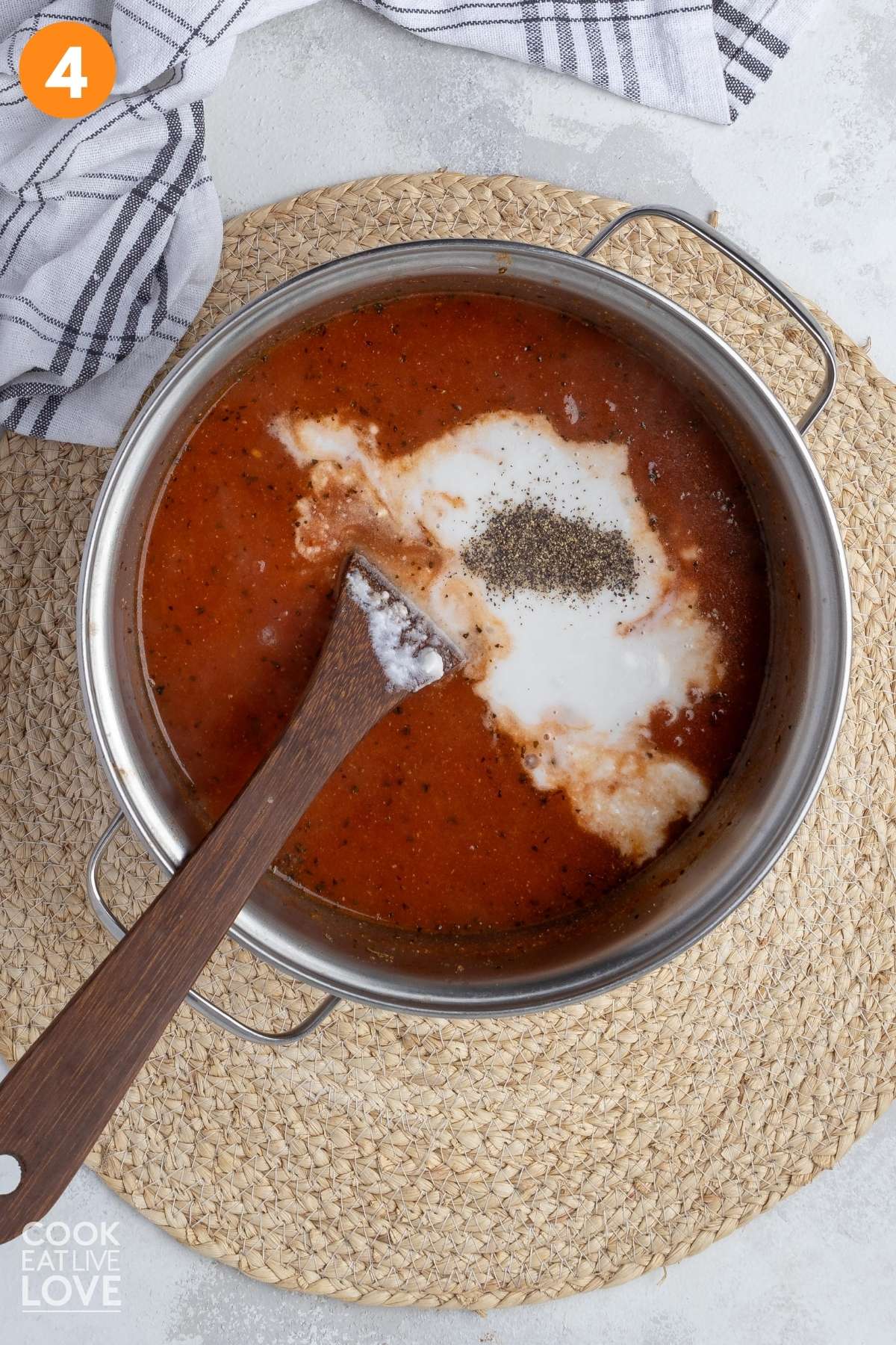 Coconut milk and black pepper added to the pot.