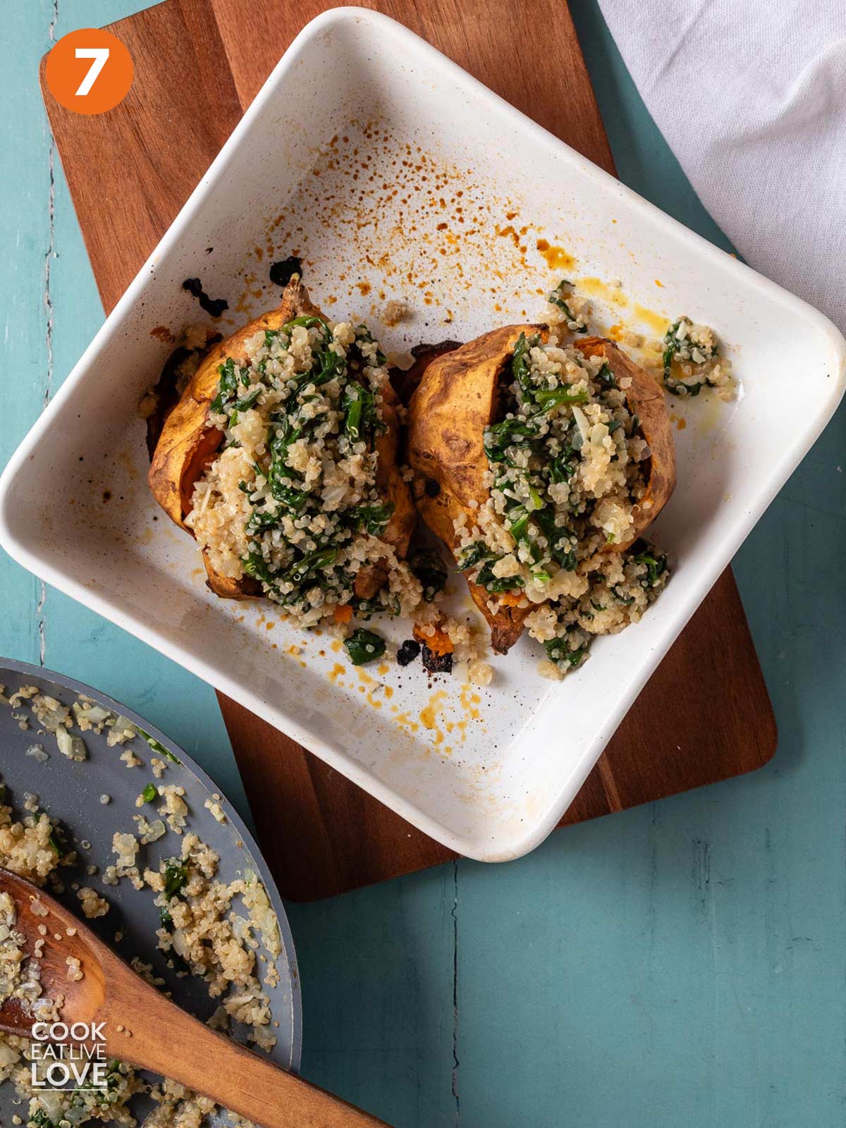 Quinoa and spinach mixture stuffed into sweet potatoes.