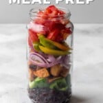 Pin for pinterest graphic with a jar of salad prepped in advance for lunch.