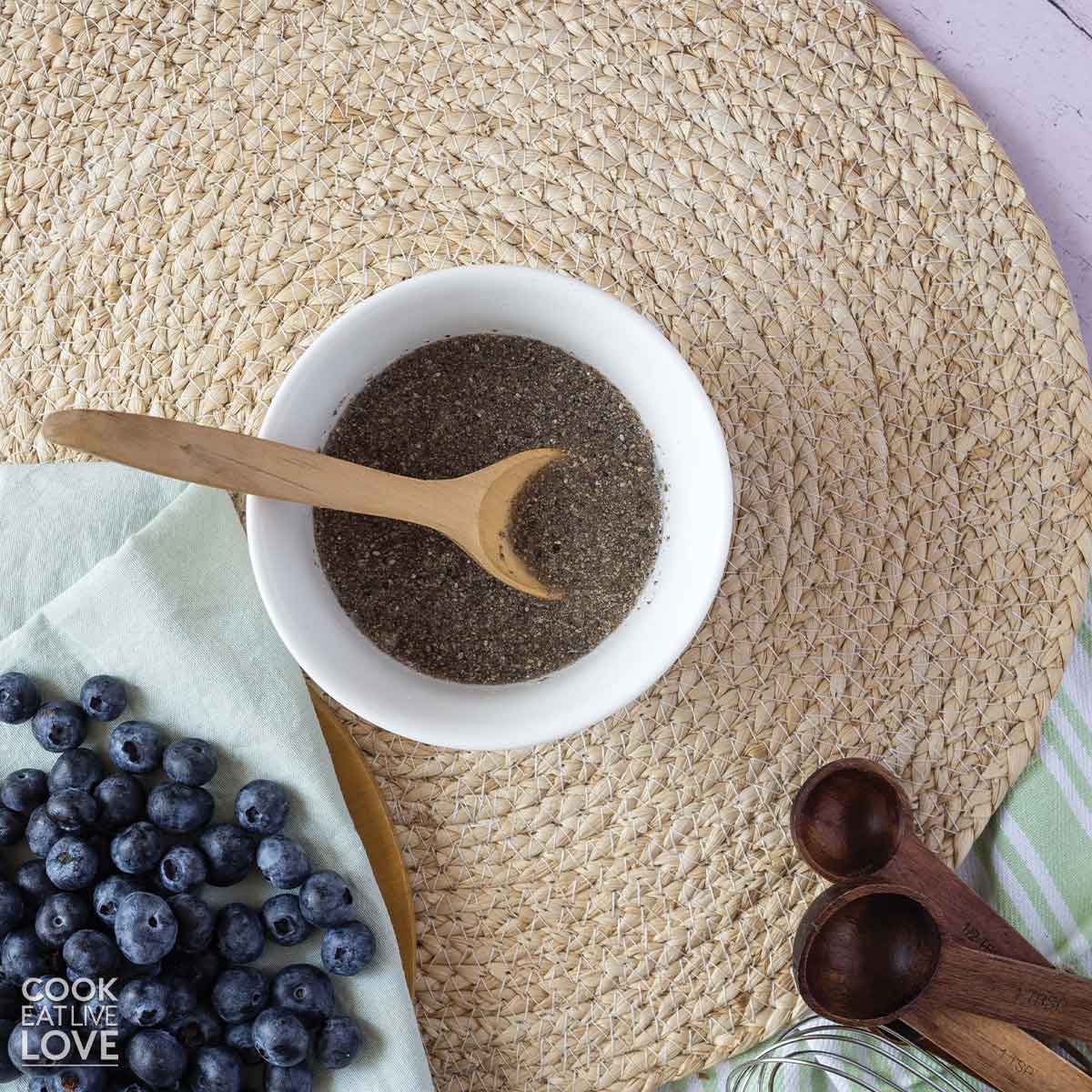 Chia egg in a bowl with a wooden spoon.