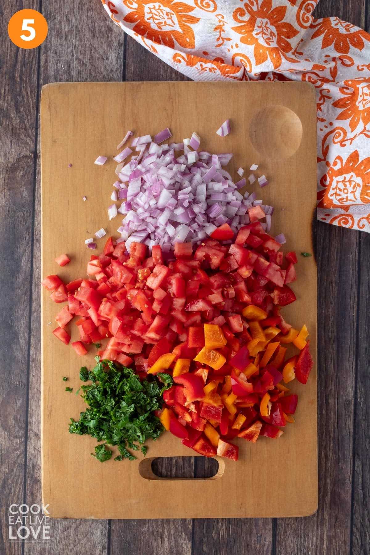 Vegetables all chopped on a cutting board.