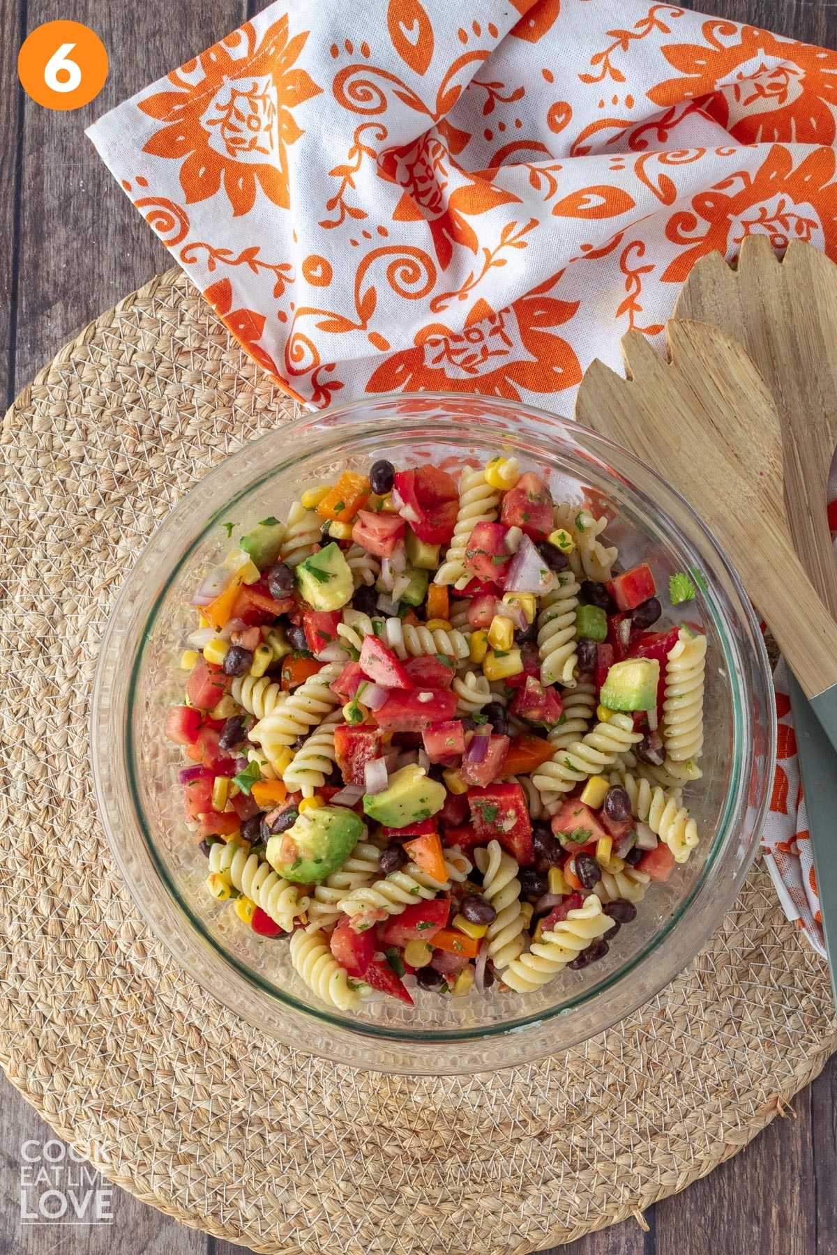 Black bean pasta salad all mixed up in a glass bowl.