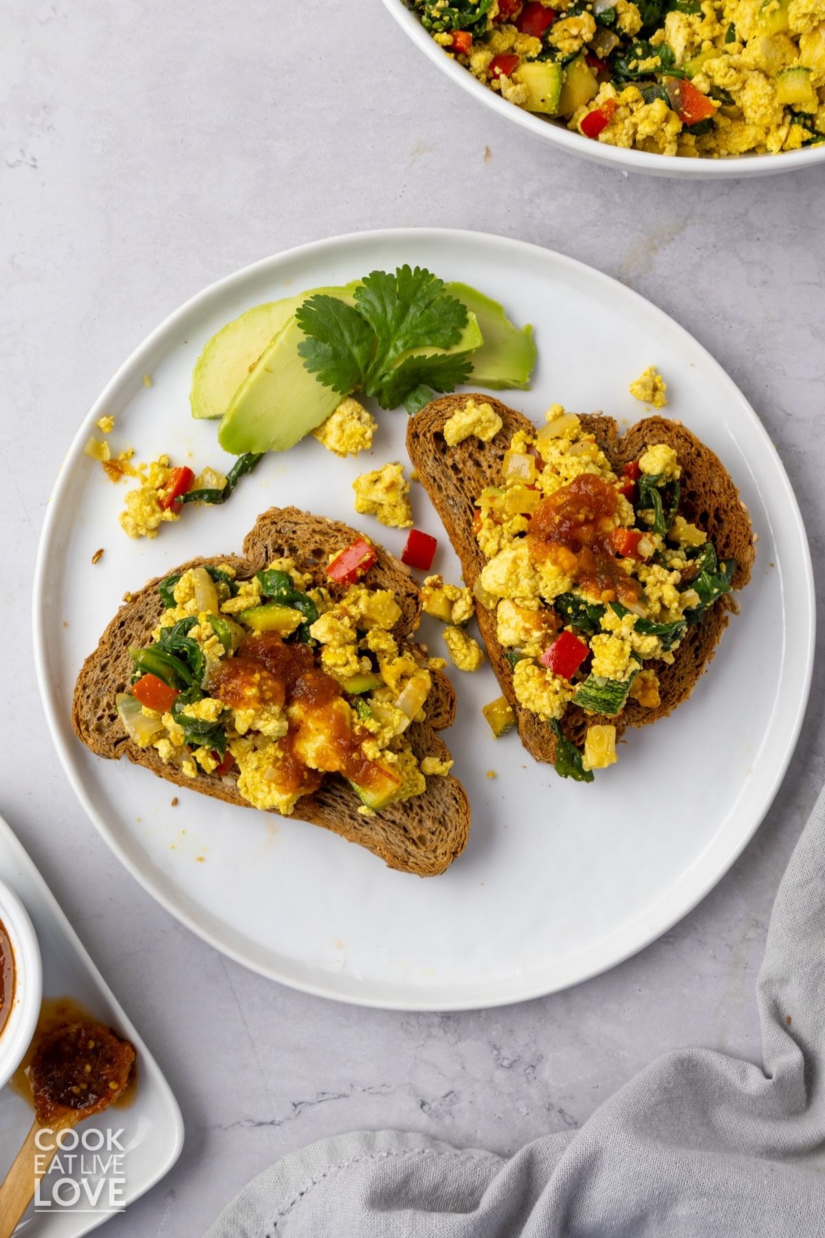 Tofu scramble on two slices of toast. 