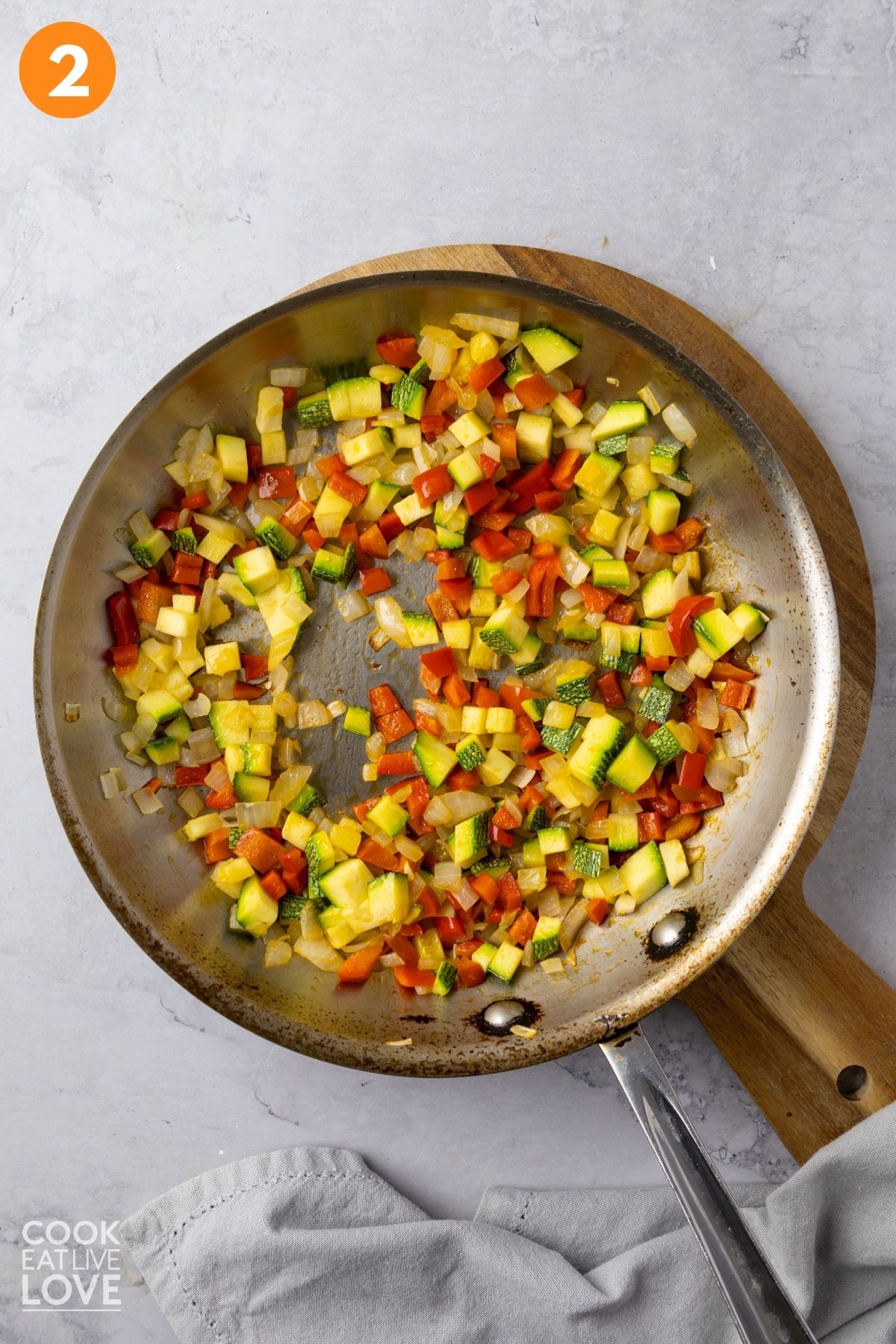 Vegetables cooking in a skillet. 