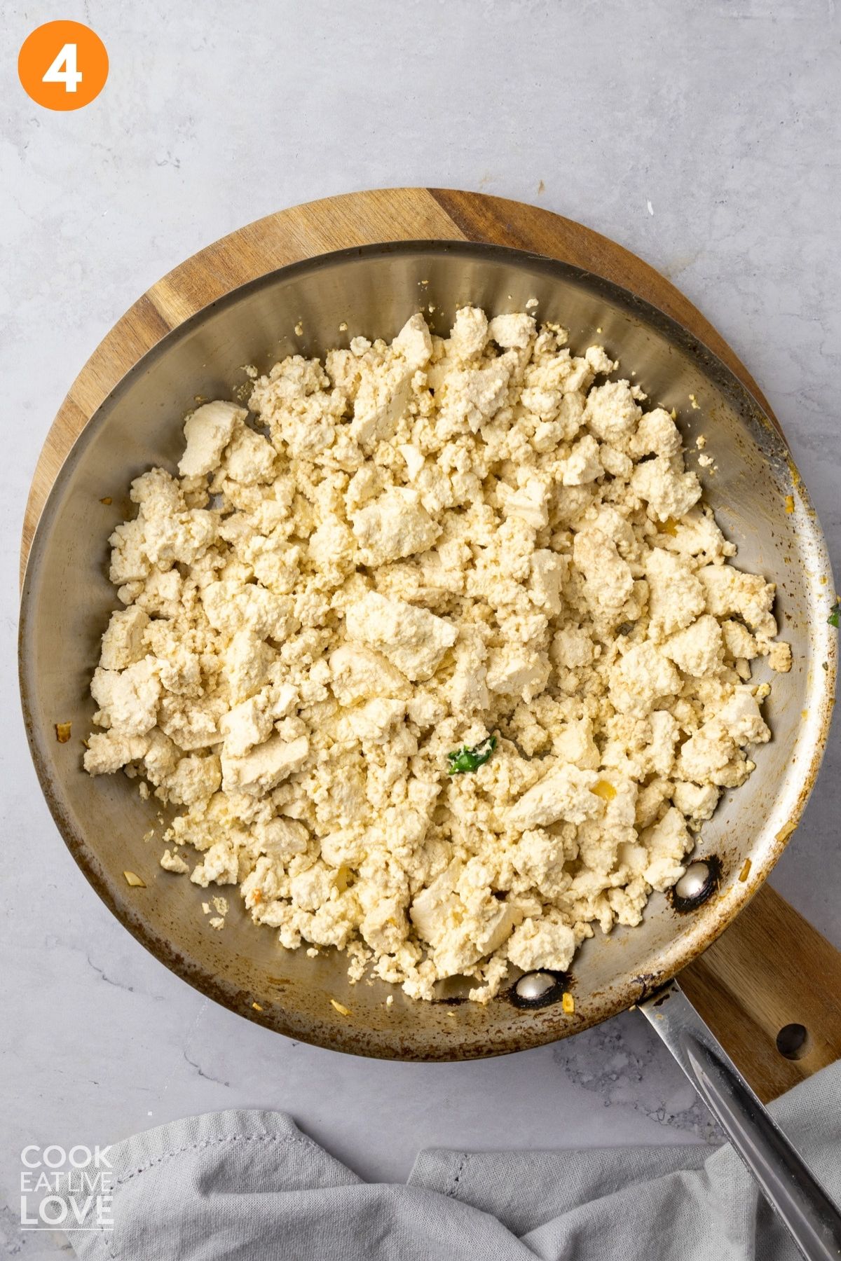 Crumbled tofu in a skillet. 