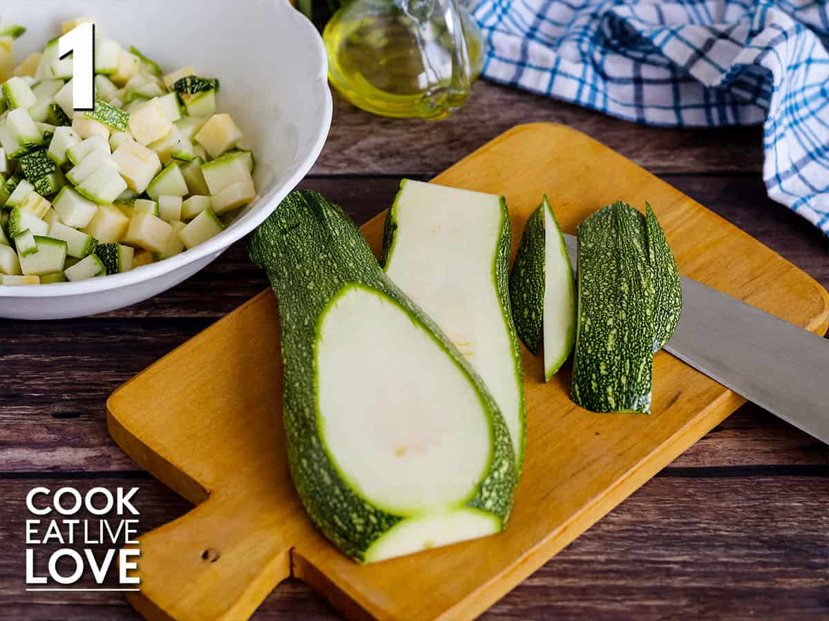 Zucchini sliced and diced on a cutting board and in a whlte bowl, demonstrating the size to cut zucchini.
