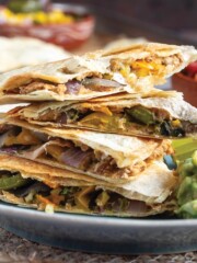 Stack of vegan quesadillas on a plate.