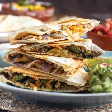 Stack of quesadillas on a plate.