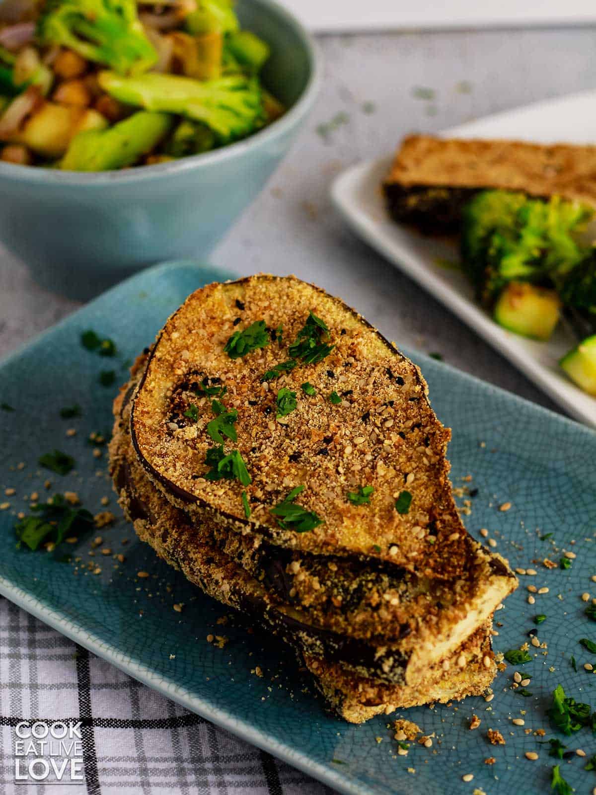 A plate of crispy eggplant on a table.